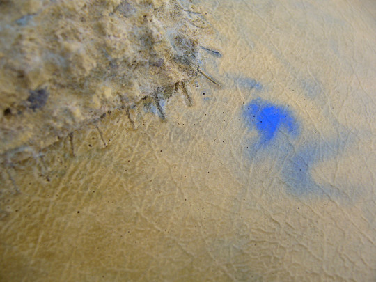 Concrete moulded on a stitched faux leather and knitted surface