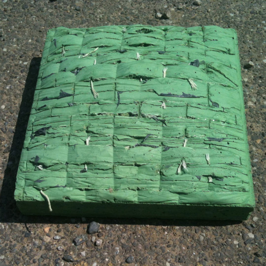 Concrete moulded on woven surface