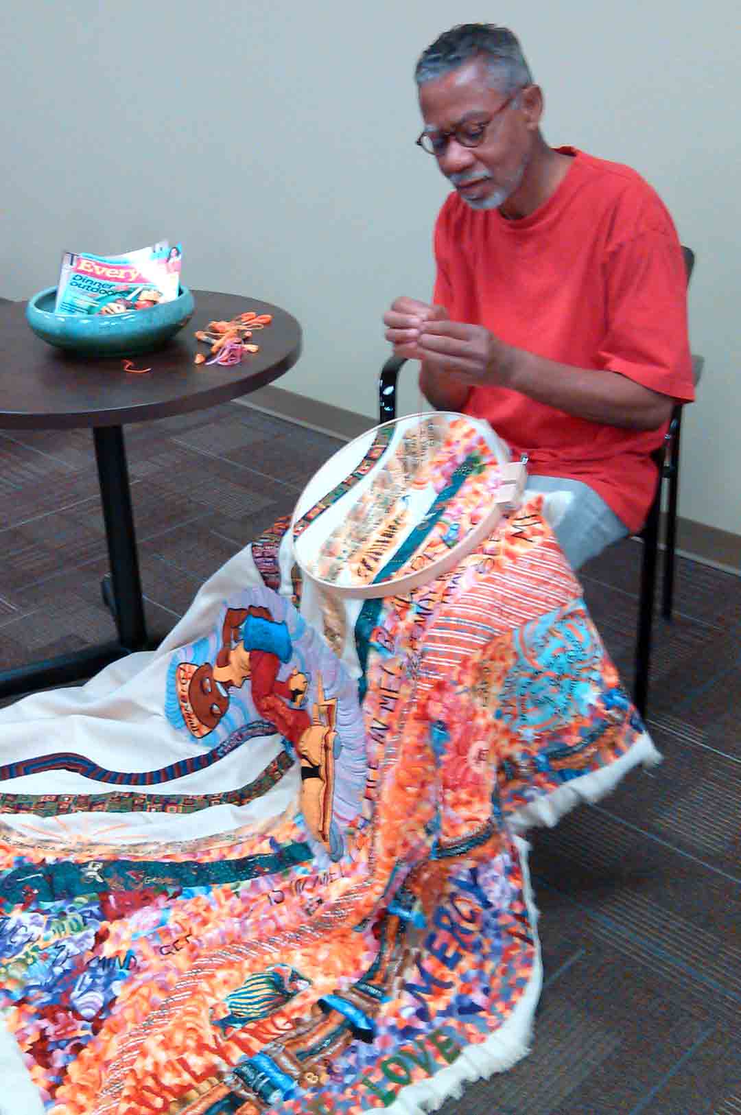 Joseph Mallard making an art quilt