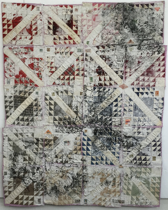 The Desolation of Goodbye. 2015. 82x45. Vintage “memory” quilt sewn and signed by several members of one family. spackling. postage stamps, printed sand in the pattern of maps from places in the world affected by migration and diaspora.