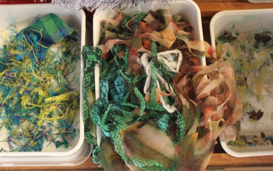 Small pieces of textile gathered in plastic boxes