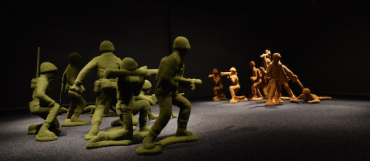 Nathan Vincent, Let's Play War! 2014-2015, Installation size varies, Crocheted yarn, foam, steel, paverpol, cotton fabric, photo credit Bellevue Arts Museum