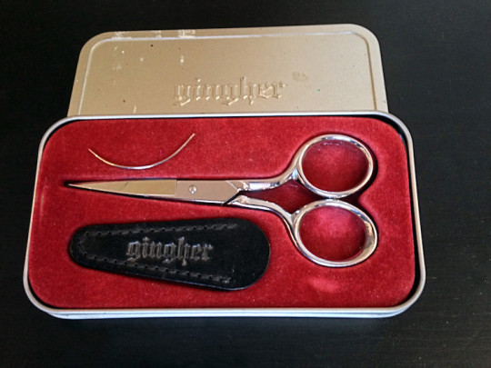Scissors and curved needle