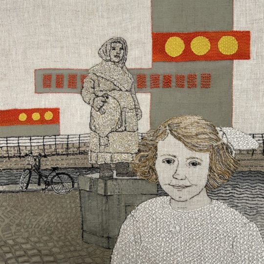 Sue Stone, A Grimsby Girl’s World Tour – Copenhagen, 2022. 30cm x 30cm (12” x 12”). Hand and machine stitch, appliqué, painting. Cotton and linen threads, acrylic paint on linen and applied silk background. Photo: Pitcher Design