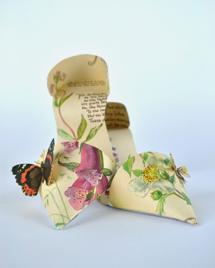 ​​Jennifer Collier, Butterfly Stilettos, 2012. 18cm x 18cm x 8cm (7" x 7" x 3"). Paper manipulation. Book pages and card.