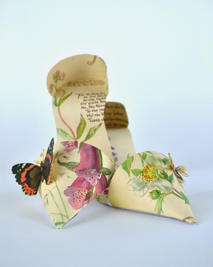 Jennifer Collier, Butterfly Stilettos, 2012. 18cm x 18cm x 8cm (7" x 7" x 3"). Paper manipulation. Book pages and card.