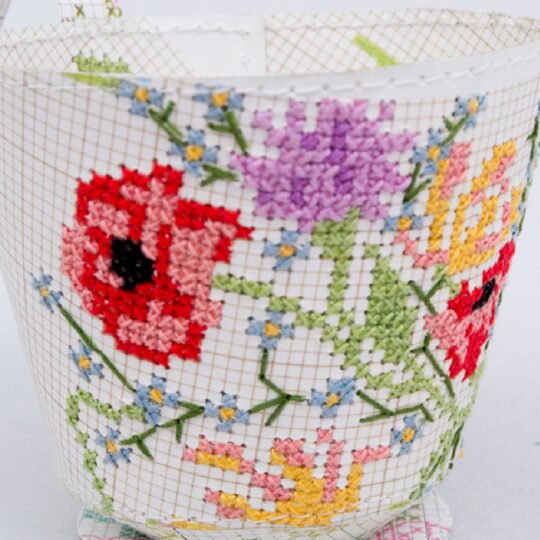 Jennifer Collier, Cross Stitched Cup, 2017. 8cm x 8cm x 8cm (3" x 3" x 3"). Hand cross stitch machine stitch. Vintage cross stitch patterns, crochet thread and machine thread.