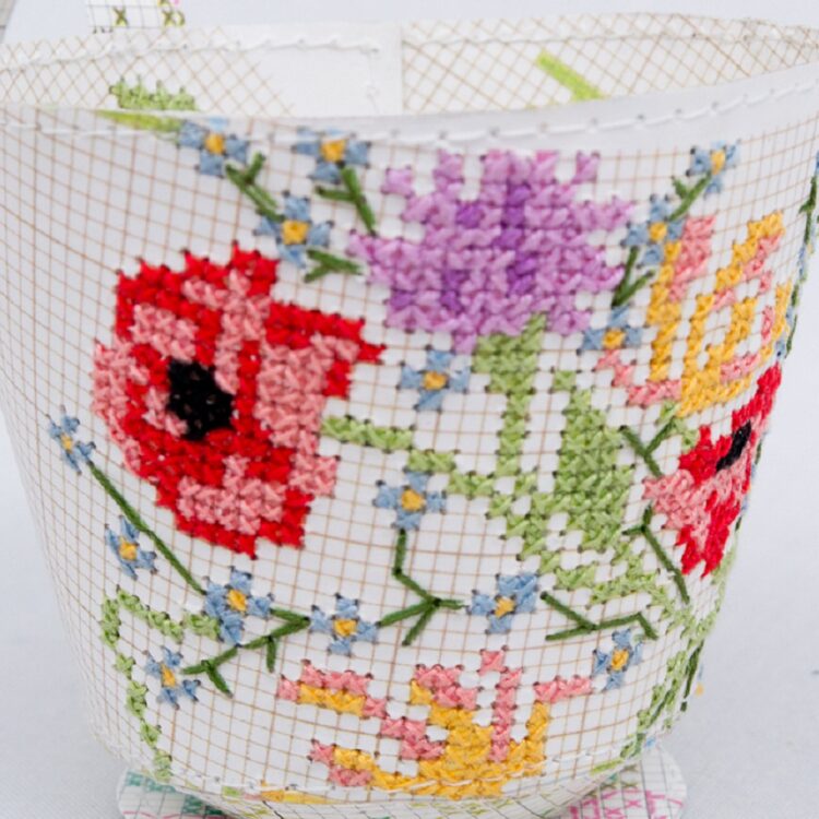 Jennifer Collier, Cross Stitched Cup, 2017. 8cm x 8cm x 8cm (3" x 3" x 3"). Hand cross stitch machine stitch. Vintage cross stitch patterns, crochet thread and machine thread.