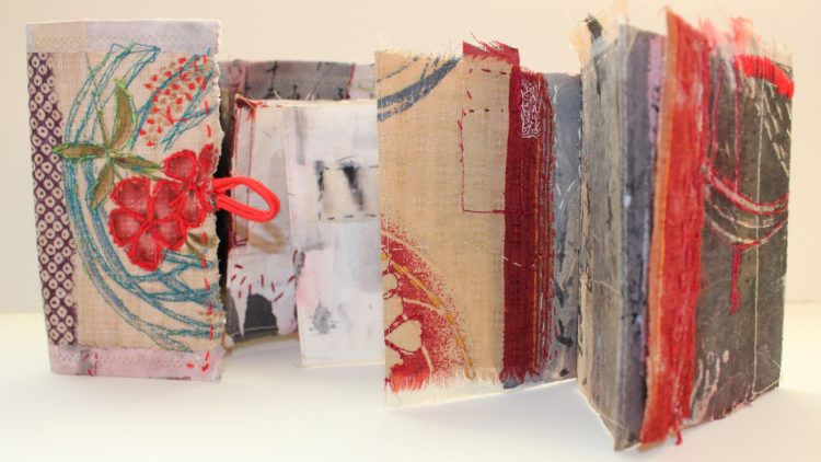 Cas Holmes, Akai Hana (Red Blossom), 2022. 13cm x 95cm (5" x 37"). Painted and dyed vintage materials, collage, machine and hand stitch. Japanese cloth and papers.