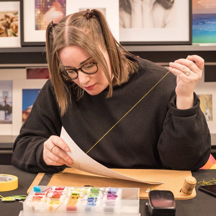 Liz Jeary, stitching an image. Photo: Matthew Lally