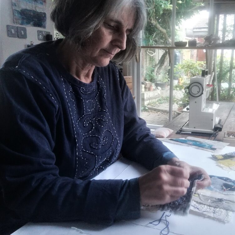 Cas Holmes, working in her studio.