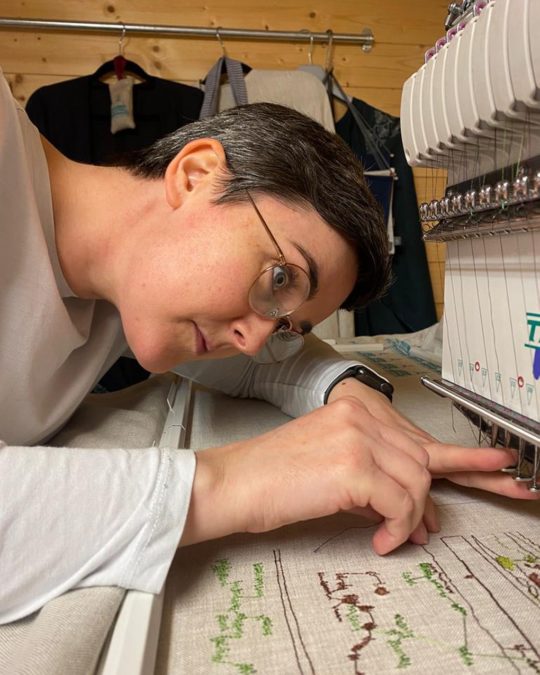 Deborah Toner working at the embroidery machine in her studio in Belfast.