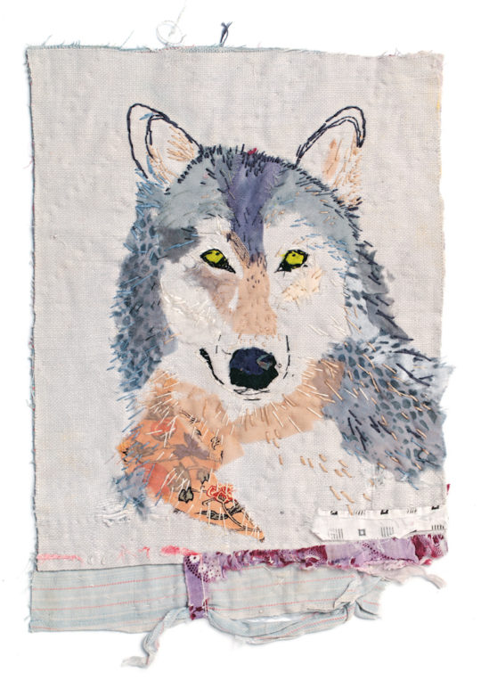 Mandy Pattullo, Grey Wolf, 2013. 30 x 21cm (12 x 8in). Long and short stitches, over the collaged areas, follow the direction of the fur growth.