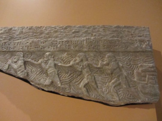 Neo- Assyrian Stone Freeze roughly 721BC, Men pulling a river barge loaded with logs