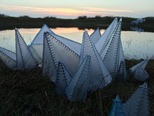 Hannah Streefkerk, Reflection, 2015, Plastic sheets sewed together with yarn, the Kristals are placed around a small pond on the island Ameland, The Netherlands