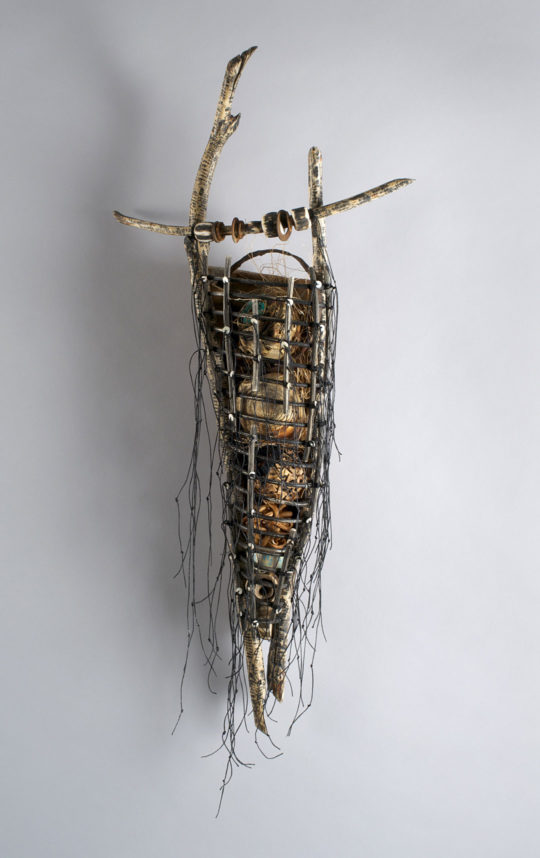 Talisman 2013 34″ x 15″ x 7″ Beaver sticks, woven frame of willow, waxed linen thread, clam shell beads. Caged objects woven, stitched, carved, beaded of Pacific Bullwhip sea kelp, reclaimed beach metals