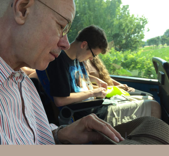 Tom Lundberg and student, mending lesson on a bus in Italy, 2017