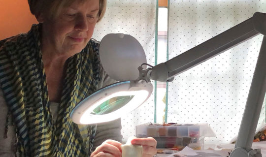 Mary at work using the LightView XL Magnifying Glass Light