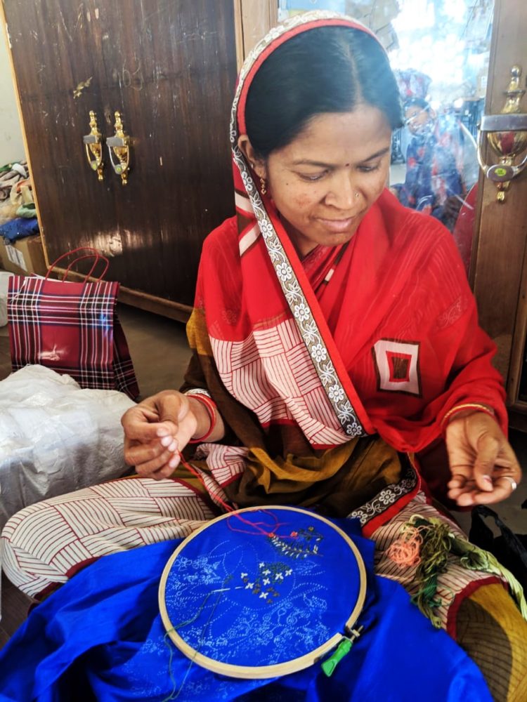 Saheli Women: Sharmely working on the embroidery for the back of the jacket, 2019, Thread embroidery