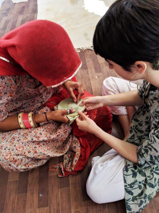 Saheli Women: Juliette and Shoba working on new stitches, 2019, Thread embroidery