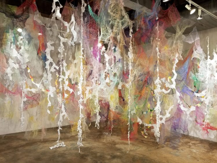 Holly Wong: Mind/Forest, 2018, 20’L x 15’D x 14’H, Polyester tulle, thread, duralene plastic, polypropylene plastic rope, cotton gauze, origami paper, and mono-filament wire