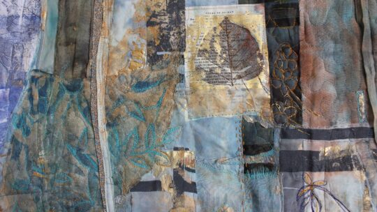 Cas Holmes, Glimmer 3 (detail), 2022. 96cm x 90cm (38” x 35”). Monoprint, stencil and freehand painting, collage, appliqué, quilting, machine and hand stitch. Reclaimed cloth, pages from a book and prescription dockets, paints and dyes.