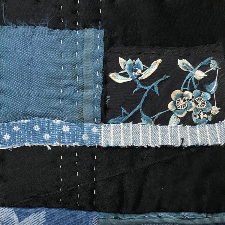 Mandy Pattullo, Chinese Flower (detail), 2022. 12cm x 18cm (5” x 7”). Hand pieced and embroidered collage. Indigo dyed fabric, Chinese embroidery fragment, antique quilt fragment, sari strip and recycled clothing.