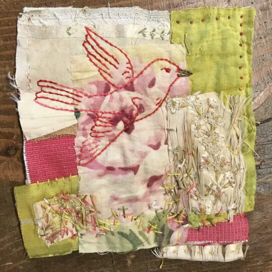 Mandy Pattullo, Pink Bird, 2022. 14cm x 14cm (6” x 6”). Hand pieced and embroidered collage. Antique French fabric, reverse of 18th century ribbon work, antique silk ribbon, over-dyed quilt fragment.