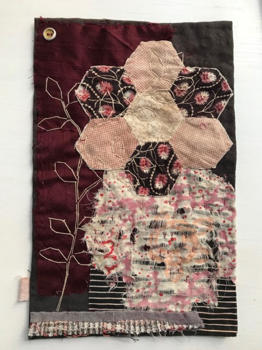 Hexagon Sprig (2020), 25 x 18 cm. Textile collage with found hexagon patchwork and stitch.
