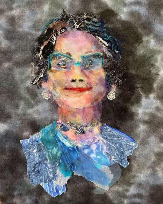Barbara Shaw, Self Portrait, 2023. 26cm x 34cm (10” x 14”). Hand stitch. Organza, lace, silk, sparkly bits, printed cotton and grey thread.