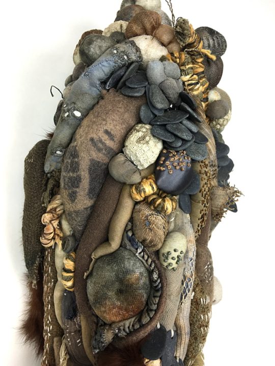 Clarissa Callesen: Shore (Detail), 2017, 24" x 8" x 4", Recycled textiles, found rocks, bullet casings