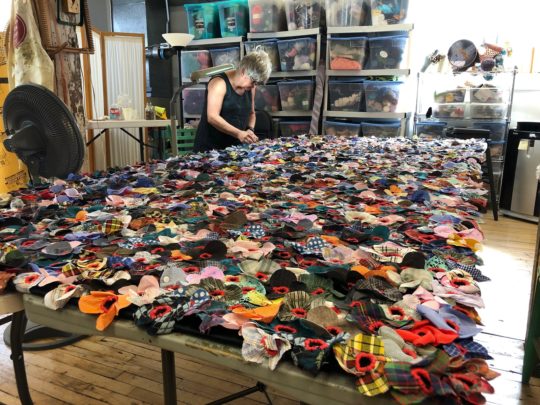 Jodi Colella: Once Was (in progress), 2019, 12 ft x 5 ft, Donated clothing, black velvet foundation, red embroidery cotton
