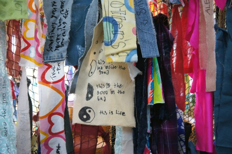 Jodi Colella: Own Your Piece/Peace (Detail), 2016, 8 h x 12 w x 9 d ft, Donated fabrics, sharpie markers, student engagement as part of a high school wellness program