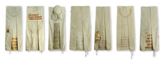 Cherilyn Martin: Seven Souls, 2018, 105 x 400cm, Retreived cotton bags, antique textile pieces, hand stitching, controlled rusting, textile paint, stencilling.