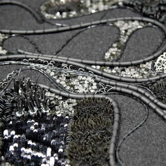 Elnaz Yazdani, Experimental Goldwork (detail), 2019. 100cm x 80cm (39” x 31”). Contemporary goldwork techniques, couching and beading. Rubber, glass, sequins, pipe, latex, crystal beads, nails, bolts on wool.