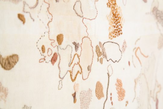 Ruth Singer: The Beauty of Stains (detail), 2015, 70cm x 45cm, Hand embroidery over stains on an old tablecloth from a gallery cafe. Photo credit: Joanne Withers