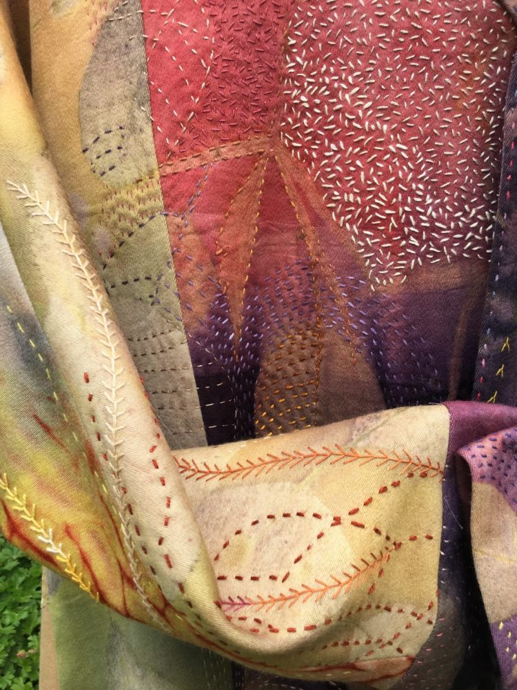 Caroline Nixon: The opera coat (Detail), 2019, Repurposed wool silk fabric. Shibori and ombre dyeing with natural dyes. ecoprinted. Copious hand stitch embellishment. Garment constructed by machine