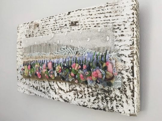Emily Notman: Devon Landscape, 2019, 12cm x 20cm, Wool tops, felt, yarn, fabric mounted on rustic wood