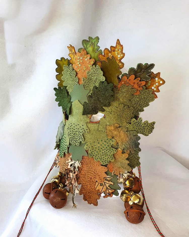 Kate Tume, Oak King, 2022. 28cm x 28cm (11” x 11”). Felt, cotton, polyurethane, teabags, bells, sequins, beads, ribbon.