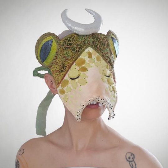 Kate Tume, Portal Mask, 2021. 21cm x 21cm (8” x 8”). Felt, cotton, wire, beads, sequins, ribbon.