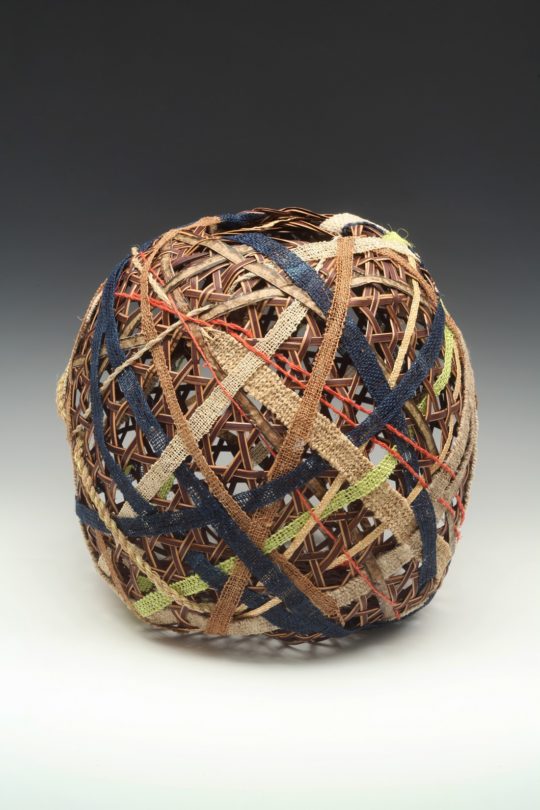 Barbara Shapiro: Strength in Diversity, 2019, 12 x 12 x 12”, plaited sedori cane, handwoven bands of 10 different bast fibers and paper. Photo credit, Don Felton