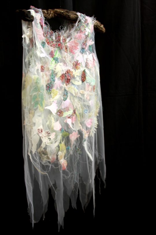 Monique Day-Wilde, A(d)dress Matters, 2020. 500 x 1000mm, Net dress with botanical monotypes on paper, waste thread machine stitched plant cut outs.