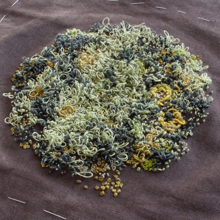 Heidi Ingram, Lichen work in progress, 2022. 18cm x 20cm (7" x 8"). Hand stitch, needle punch. Stranded cotton and linen threads, linen fabric.