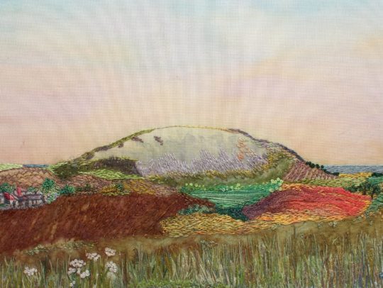 Heidi Ingram, Traprain Law, 2018. 23cm x 18cm (9" x 7"). Hand stitch, paint, collage. Stranded cotton threads, cotton fabric.
