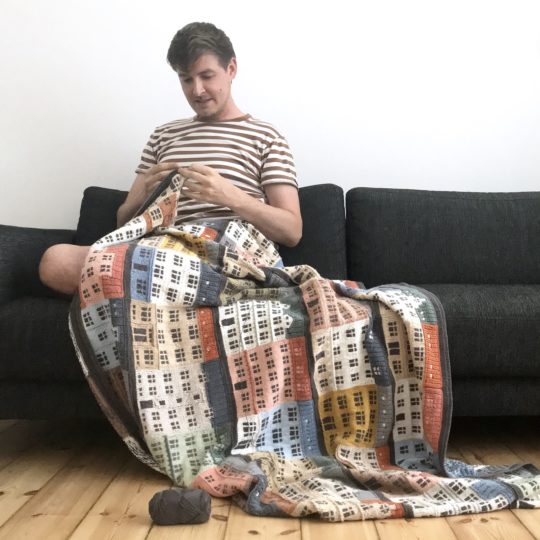 Jake Henzler adding the crochet border to Copenhagen Building Blocks