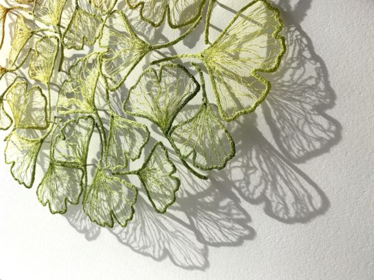 Meredith Woolnough, Gold to Green Ginkgo Circle, (detail). 2021. 63cm x 63cm (25” x 25”). Freehand machine embroidery on water-soluble fabric. Embroidery thread and pins on paper.