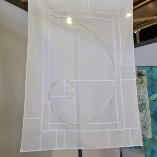 Maryse Allard, Golden Spiral. (2019). 75cm x 100cm (30” x 39”). Bojagi flat felled seam and embroidery. Organdy.