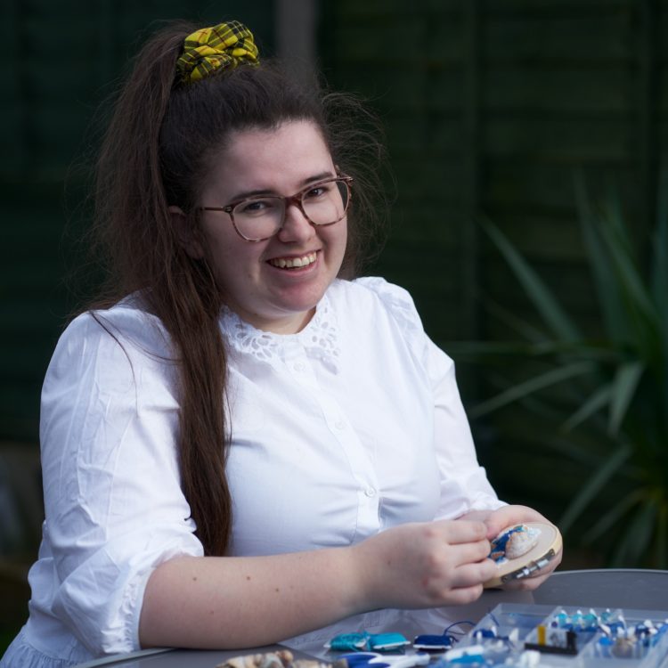 Bethany Duffy stitching outside. Photo: Chris Howarth.