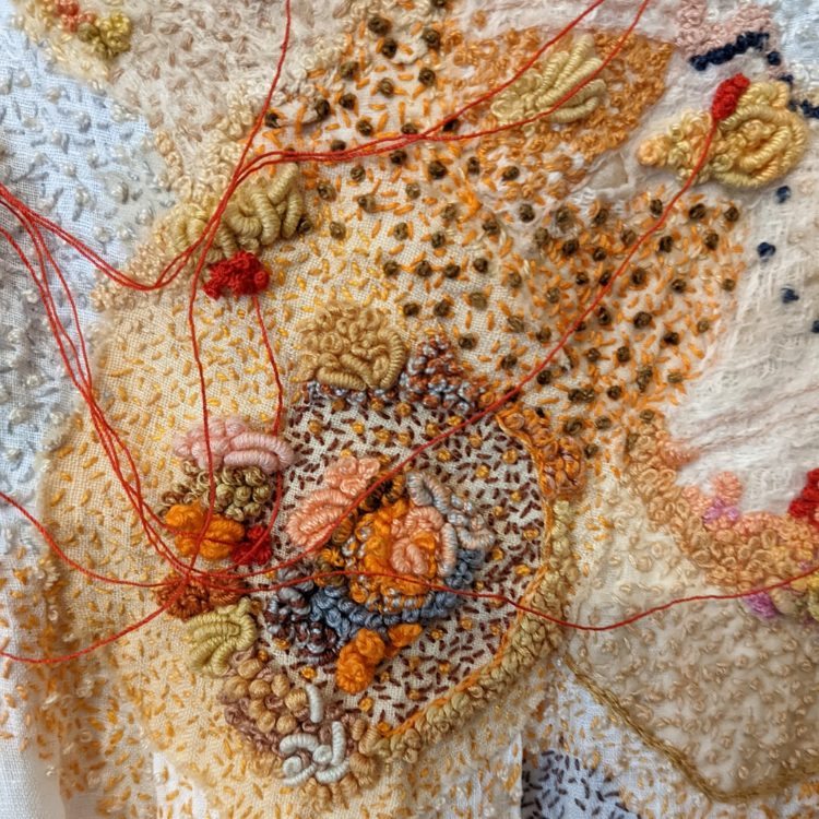 Joy Denise Scott, Real bodies have their lives stitched into them: Burial gown (detail), 2022. 126cm x 45cm (50” x 19”). Embroidery on artist’s worn linen frock, silk, lace, linen, cotton, mulberry bark and embroidery threads. Photo: Dianne Smith