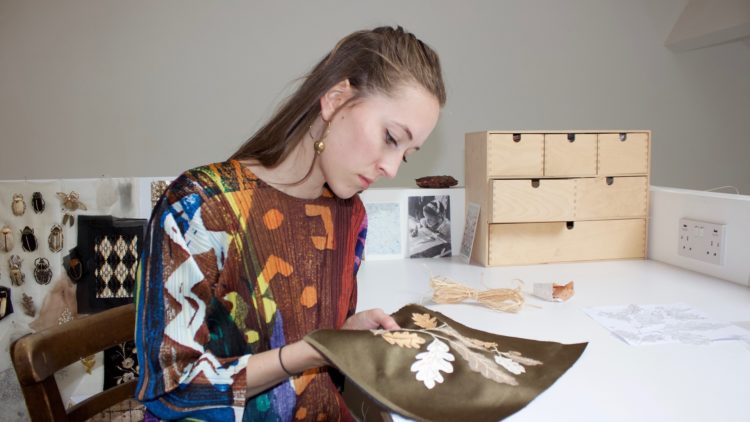 Claire de Waard in her home studio, working with birch tree peelings for the TextileArtist.org Stitch Club workshop.